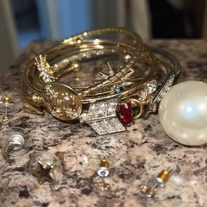 Bundle of bangles and star and moon earrings and constellation pendant